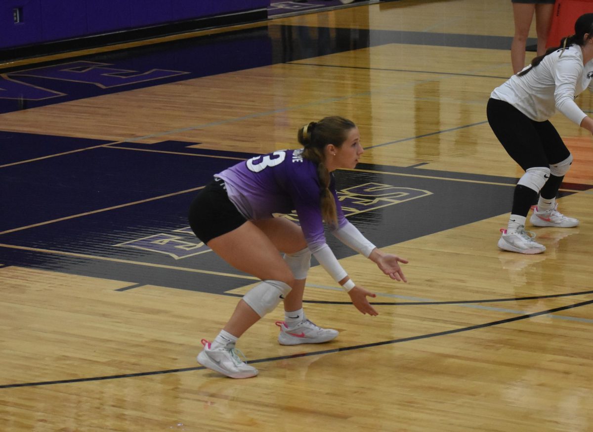 Senior Lelia Huff down and ready to pursue the ball in serve receive from the Glendale volleyball team on September 8th. She stays low and ready for action as the ball goes over the net.