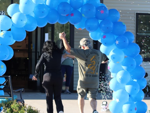 Terina Johnston and Bryan Arfons completing the 5k race at The Race of the Redeemed. They're daughter has autism and the proceeds from the race went to them.