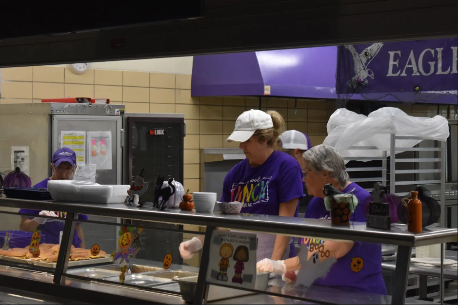 Jean Dick, Pat Bunch, and Helen McDowell serving food and smiles to third and fourth graders on October 3rd.