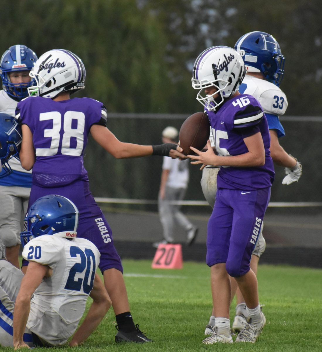Grey Pritchett (46) handing off the football to Jaiden Hicks (38) in a game against the Hollister Tigers. The Eagles won this game 38-0.