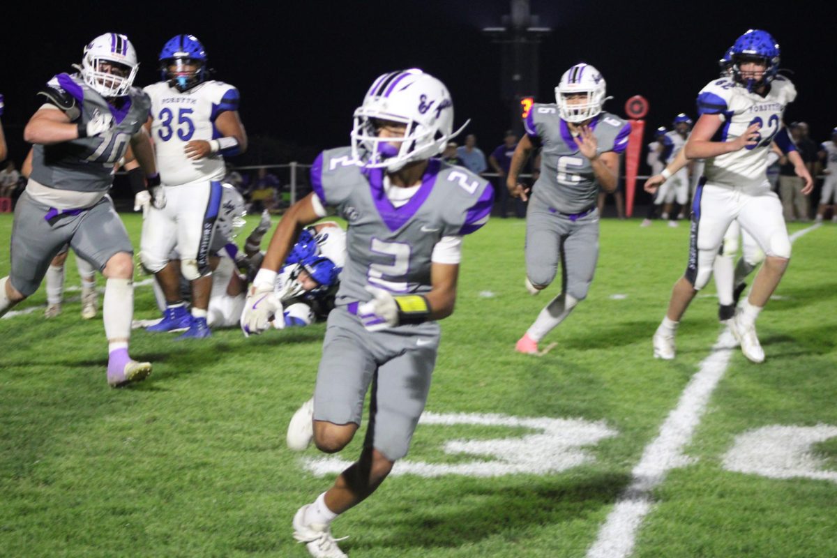 Players Eron Daugherty (11), Mathys Mallard (10), and Jackson Austin (12) running an offensive play against Forsyth on the October 17th, 2025, home game. This game was the Fair Grove football senior night.