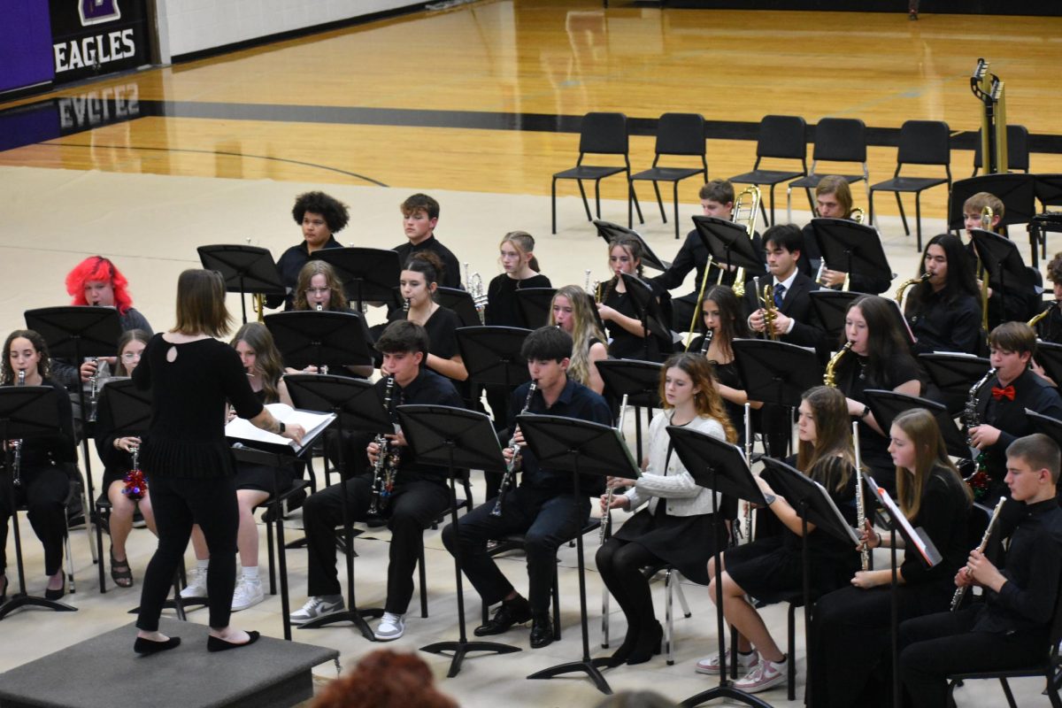Natalie Palomo conducting the Fair Grove High School band at their winter concert on December 11th. 
Front row from left to right: Guiliana Kandlbinder (12), Marley Patton (10), Beyah Widner (10), Jaiden Straw (12), Eli Sanders (12), Cheyenne Miller (12), Caydence Drake (10), Audrey Johnson (10), Aiden Johnson (9)
Second row from left to right: Elliott Roberts (11), Alexis Hoskins (9), Rachel Bennett (9), Carlie Krider (9), Alice McMains (11), Zoe Baxter (10), Anderson Teaster (10)
Third row from left to right: Dashaun Mason (11), Andrew McGuire (10), Kennedy Ferguson (10), Harlen Irvine (10), Jesse Eliston (12), Jon Peak (12)
Fourth row from left to right: Garrett McKeever (9), Lee Van Cleave (12), Benjamin Hofius (10)