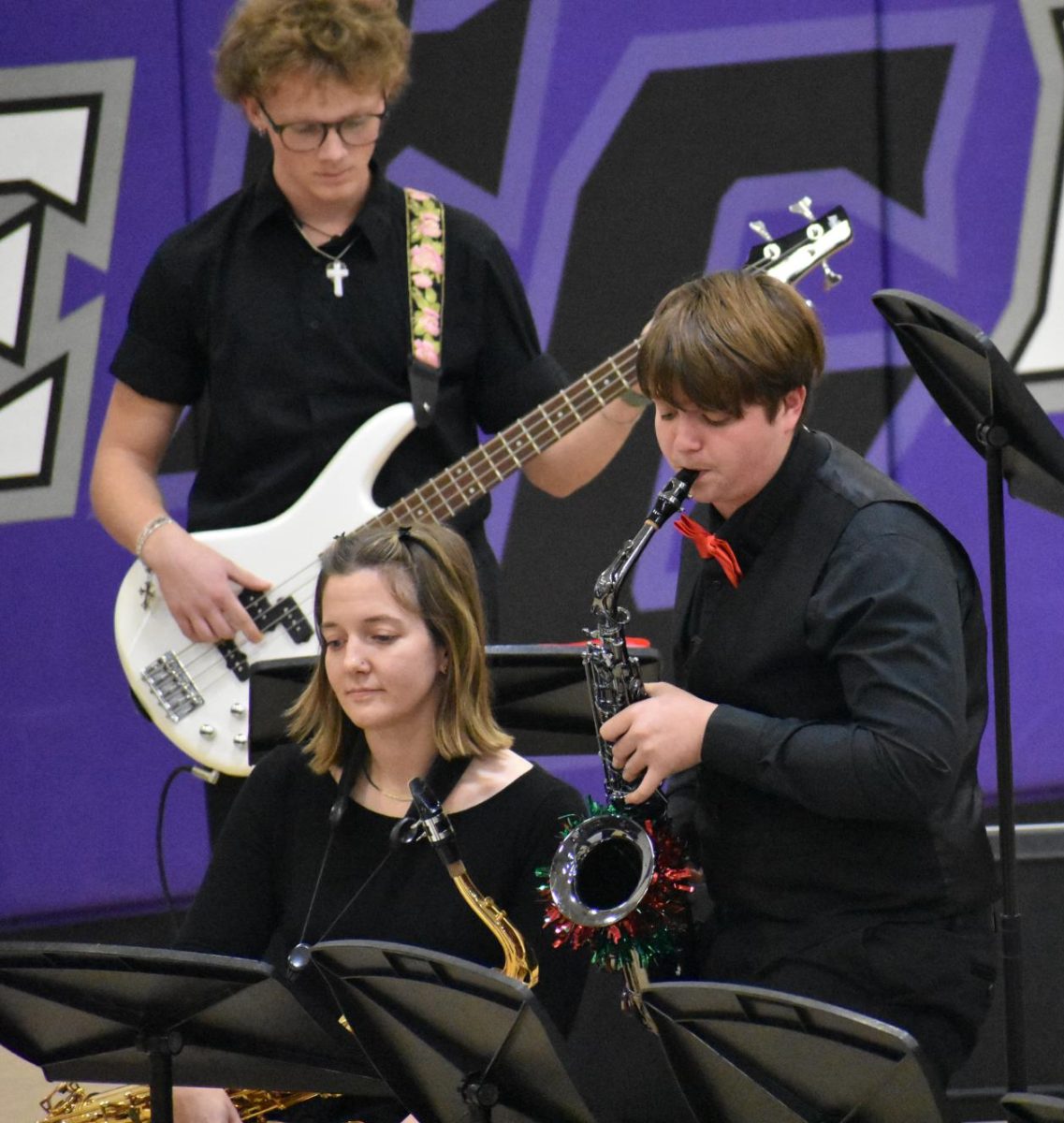 Honor band is a band made up of around 100 students from surrounding areas and Fair Grove had nine band members attend. Anderson Teaster playing the alto sax in a jazz solo at the winter band concert on December 11th. 
Left to Right: Gavin Brock (12),  Band Director Natalie Palomo, and Anderson Teaster (10)