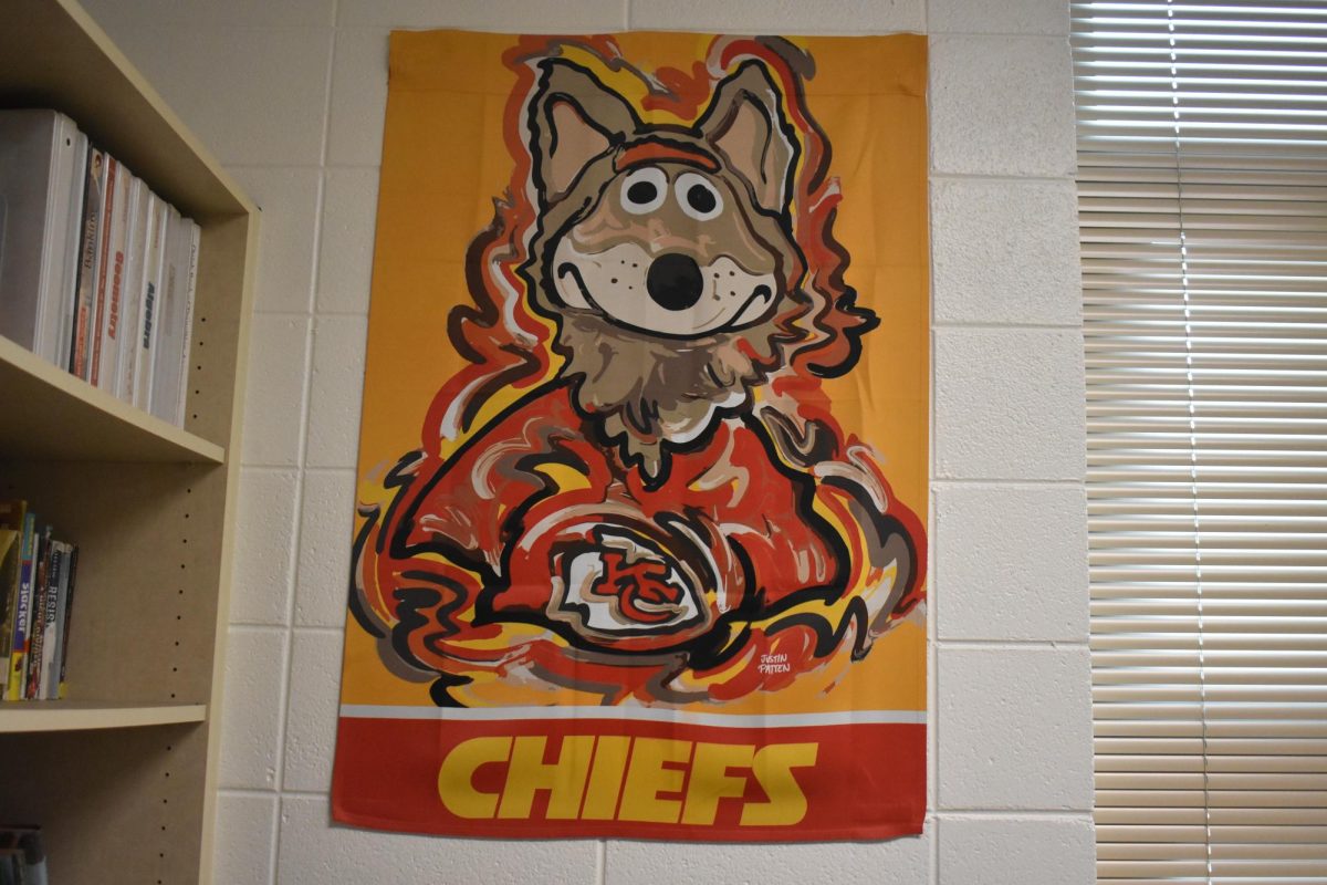 Chris Holt's Chiefs poster hanging up on his wall in his classroom. He is still a supporter of the Chiefs, even after their move. 