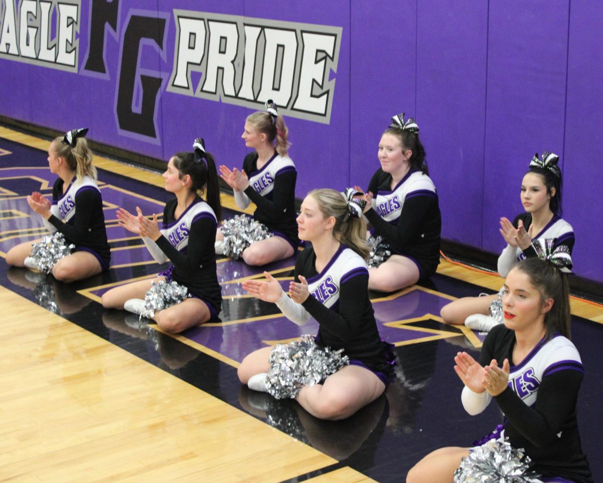 The cheer team doing a floor chant at the high school boy's basketball home game against New Heights. The game ended 65-54
Back row: Maryah Wisely (10), Zoe Baxter (10), and Presley Mauldin (9)
Front row: Elizabeth Taylor (12), Skyelar Farthing (11), Desiree Pollock (12), and Aubrie Voorhis (11)