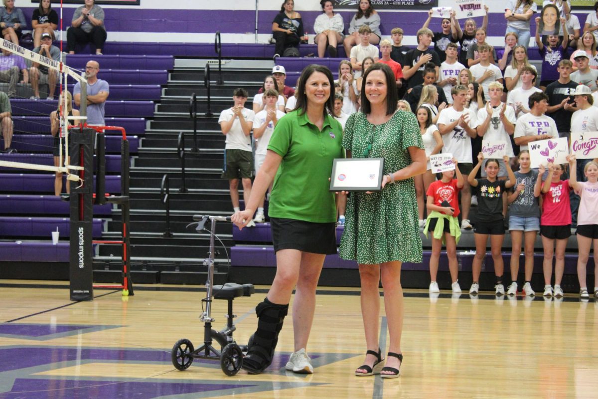 Tonya Peck receiving an award at a game against Logan-Rogersville on September 5, 2024. 