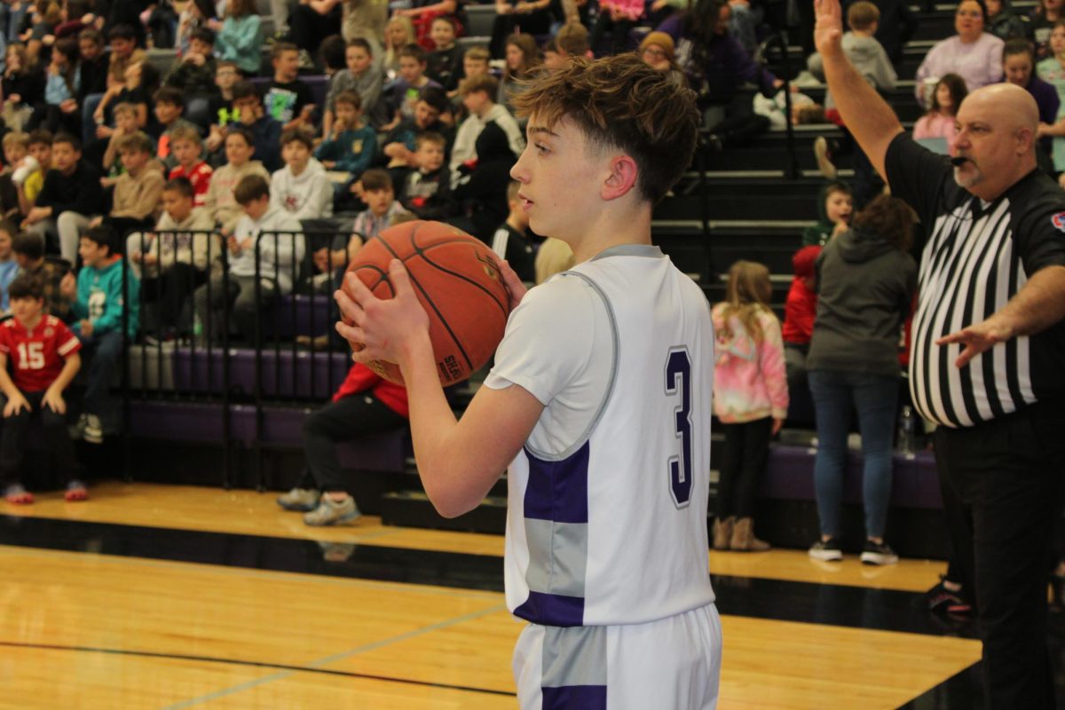 Brock Baxter throwing the ball in from out of bounds. The eighth grade boy's team lost their game to Skyline 36-39 on January 27th. 