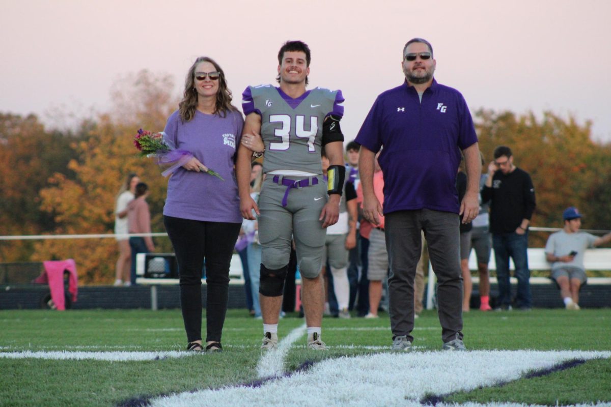 Senior Dylan George walking his parents on football senior night. George is involved in football and track and field as well as different clubs that Fair Grove provides. 
Left to Right: Aubra George, Dylan George, and Jeremy George 
