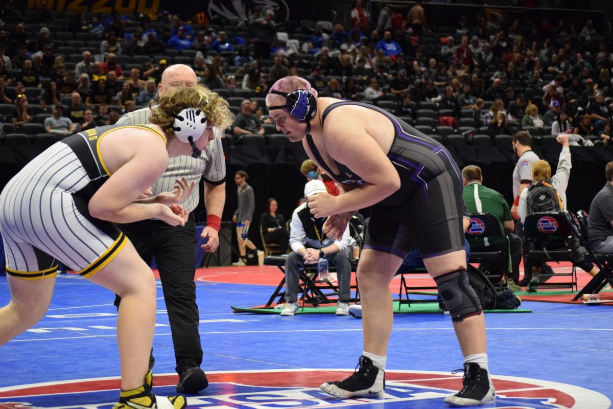 Sam Simpson (11) wrestling Maclin Limb from Cameron, Missouri, at wrestling state. 