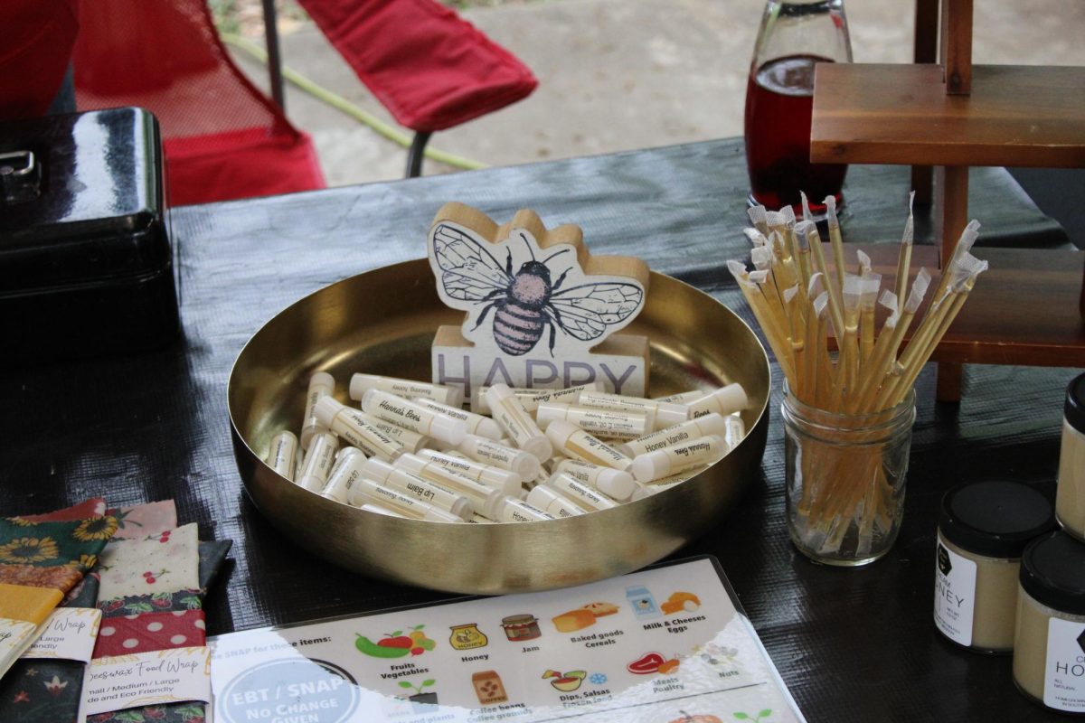 The farmers market has a wide variety of vendors. The vendor Hannas's Bees showcasing their variety of bee related products.
