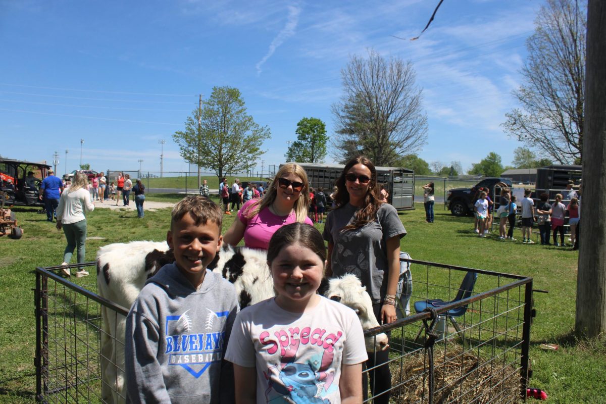 Lexi Angelo (10) and Claire Hollan (10) brought their dairy calf on farm day. Camden Smoot (4) and Remi Hill (4) learned about the calf on April 21, 2026. 