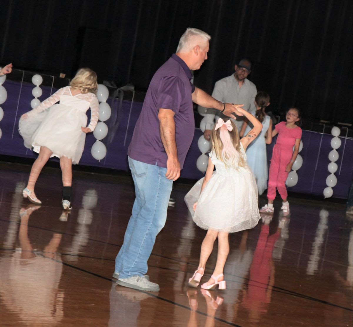 Jim Nunley and his granddaughter Aurora Nunley (K) dancing the night away at Denim and Pearls dance on April 9th, 2026 in the upper elementary gym. 